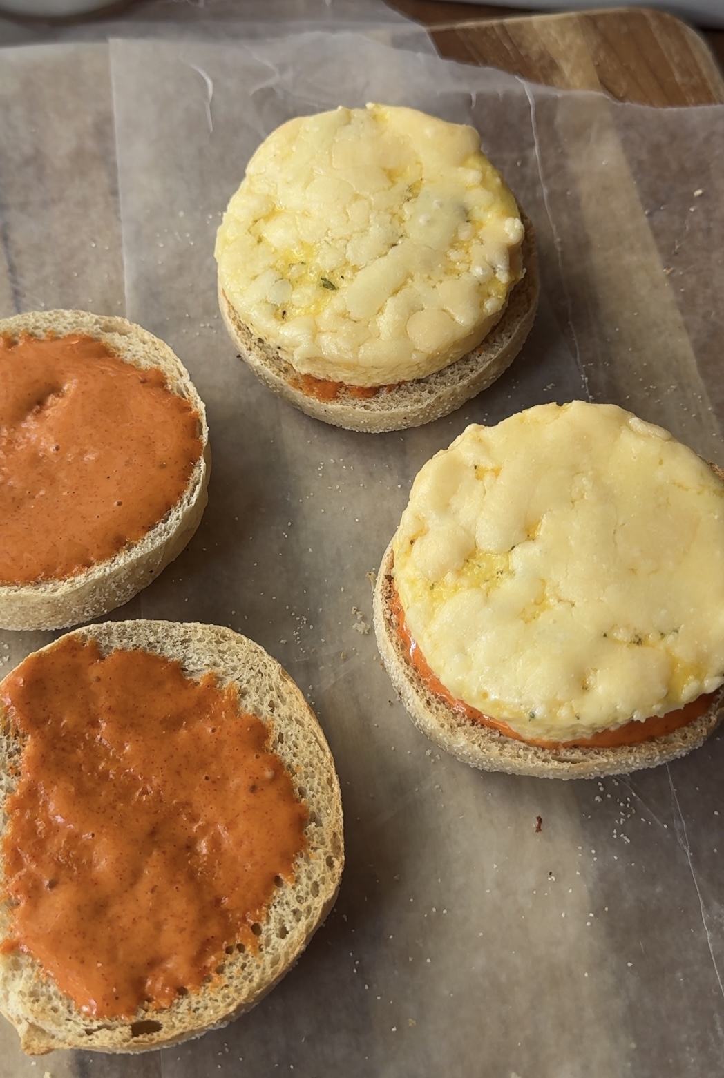 open face egg on english muffin with a spicy aioli on the other side