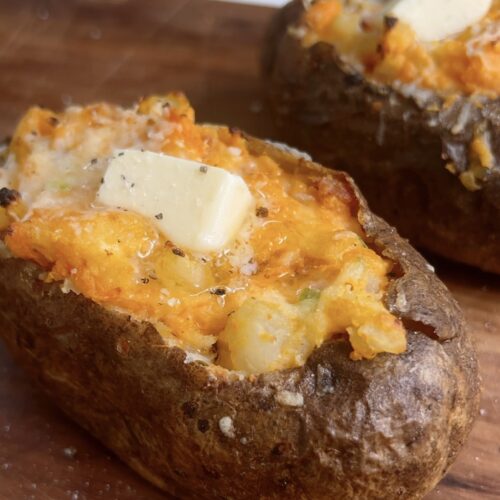 Twice baked marbled potato with a knob of butter on top