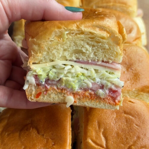 1 italian grinder slider being held above the others