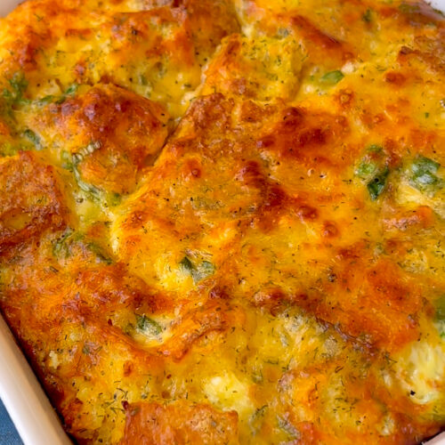 Leftover cornbread egg bake with cheese and vegetables in a baking dish
