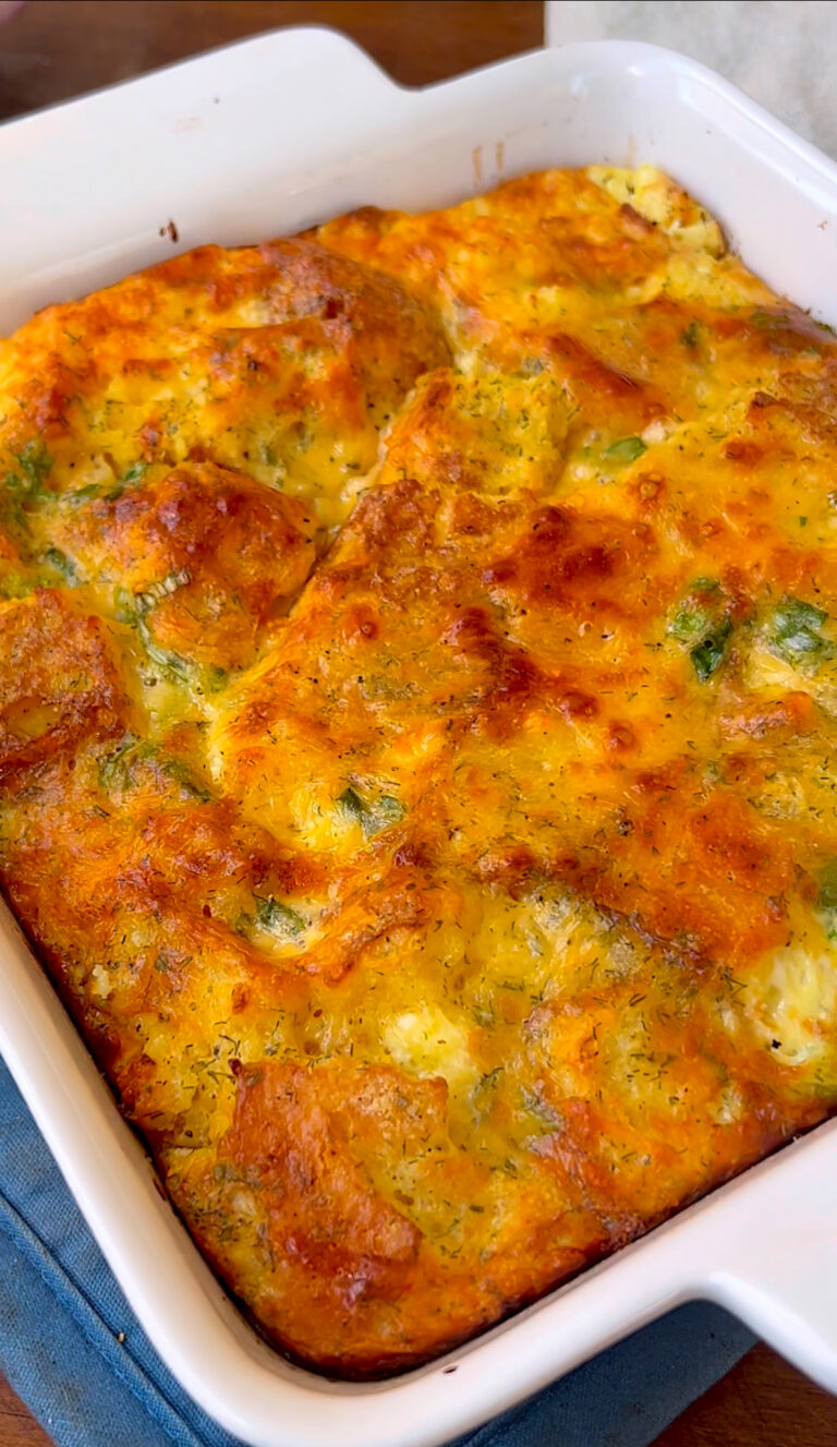 Leftover cornbread egg bake with cheese and vegetables in a baking dish