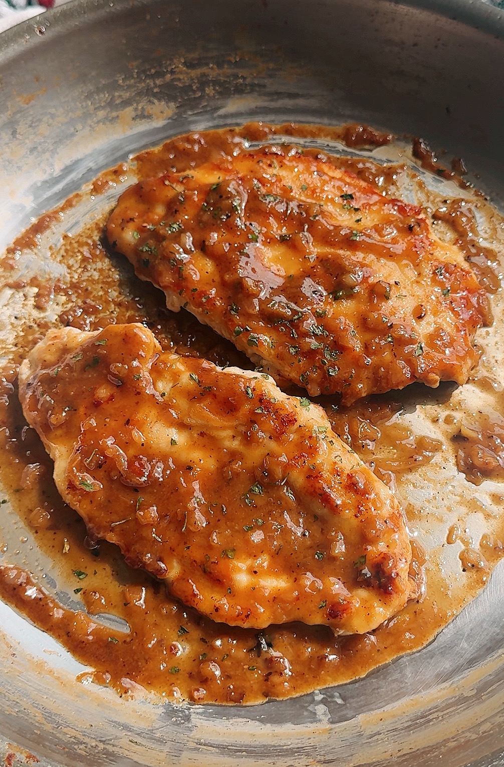 chicken marsala in a stainless steel pan