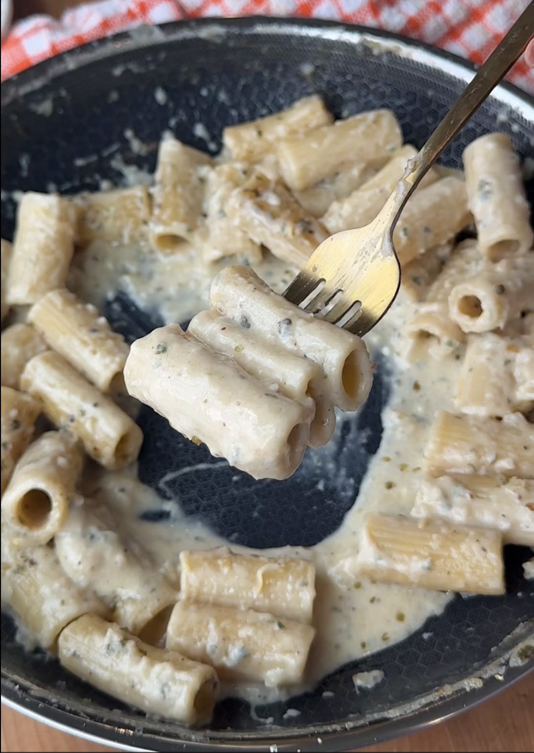 creamy lemon sauce on rigatoni on a fork