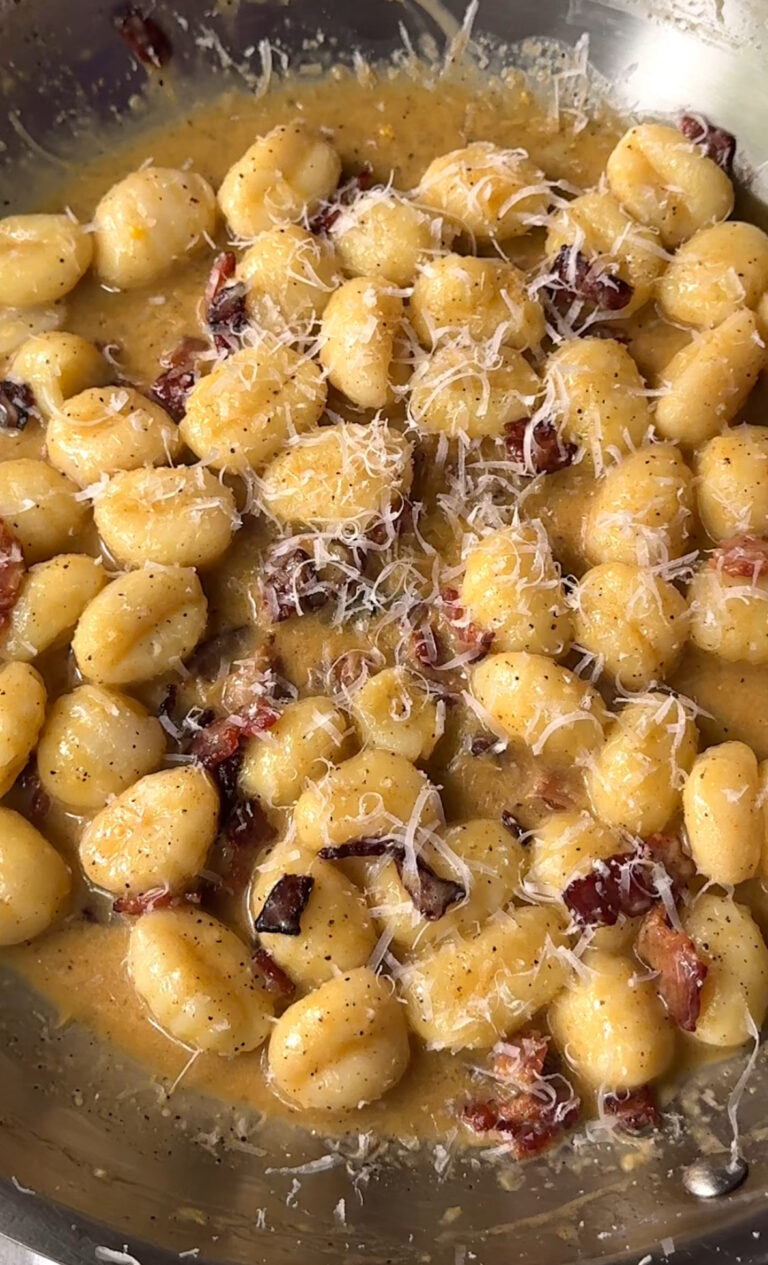 gnocchi in a creamy carbonara top with Parmesan cheese