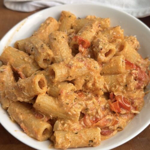 white bowl of a creamy red pasta